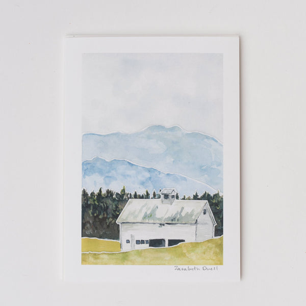 Watercolor artwork of Vermont mountains and white barn by Zarabeth Duell