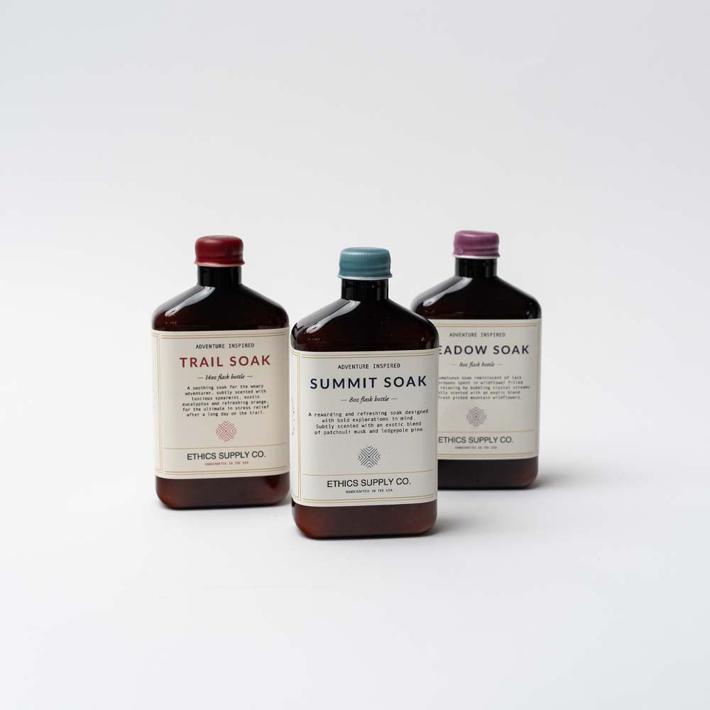 Three bottles of bath soaks by Ethics supply company on a white background