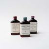 Three bottles of bath soaks by Ethics supply company on a white background