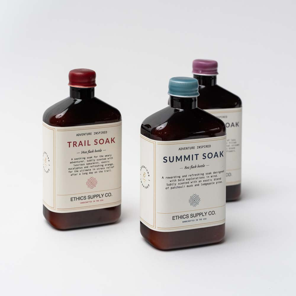 Three bottles of bath soaks by Ethics supply company on a white background