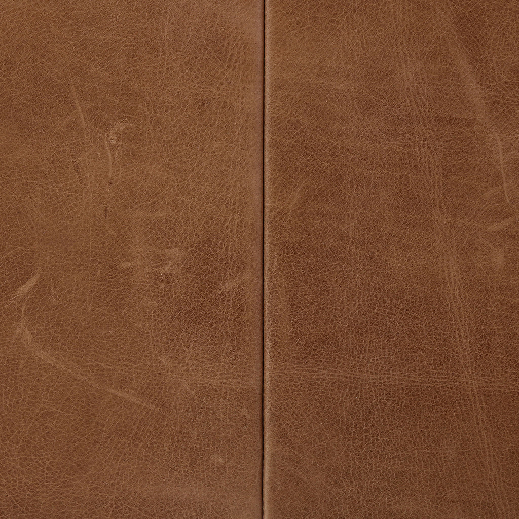 Four Hands Furniture brand Bauer chair in taupe leather with stained wood legs and leather buckled straps on a white background