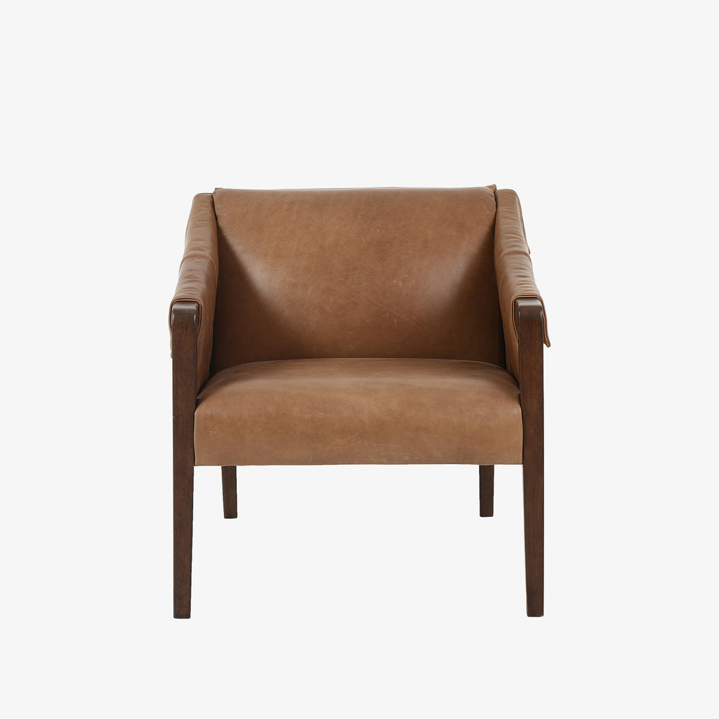 Four Hands Furniture brand Bauer chair in taupe leather with stained wood legs and leather buckled straps on a white background