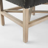 Grey upholstered accent bench with trellis wood base and small bolster back and nail head finish
