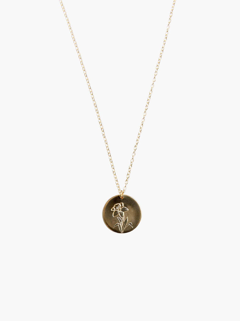 Able brand Bloom birth month daffodil necklace in 14 carat gold fill on a white background
