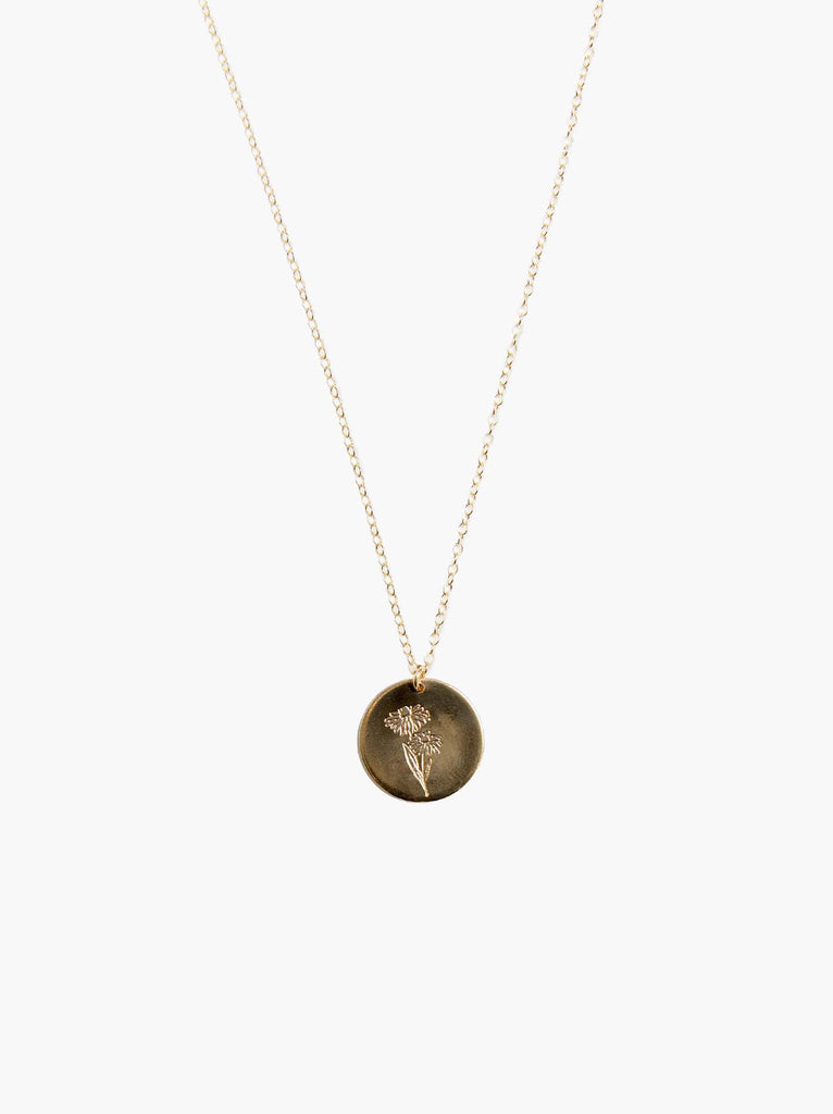 Able brand Bloom birth month daisy necklace in 14 carat gold fill on a white background
