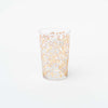 Single tea glasses with white and gold blossom design on a white background