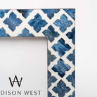 Close up of Two's company blue mosaic picture frame with geometric patterns on a white background