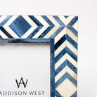 Close up of Two's company brand blue mosaic picture frame with geometric patterns on a white background