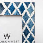 Close up of Two's company brand blue mosaic picture frame with geometric patterns on a white background