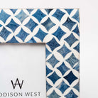 Close up of Two's company blue mosaic picture frame with geometric patterns on a white background