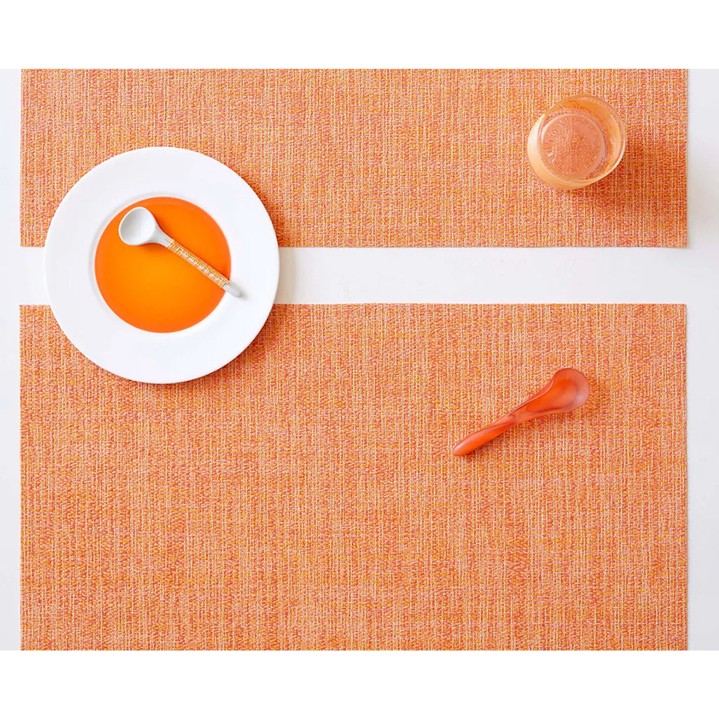 Chilewich boucle rectangle placemat in tangerine orange on a white background