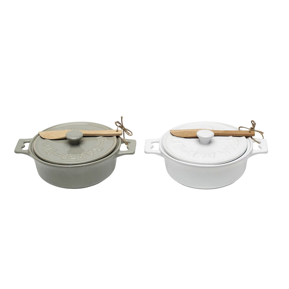 White and grey brie bakers side by side on a white background