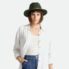 Brixton brand Messer fedora hat in moss green on model with white shirt and jeans a white background