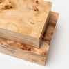 Close up of two burl wood boxes stacked on top of each other on a white background