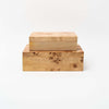 Set of two burl wood boxes stacked on top of each other on a white background