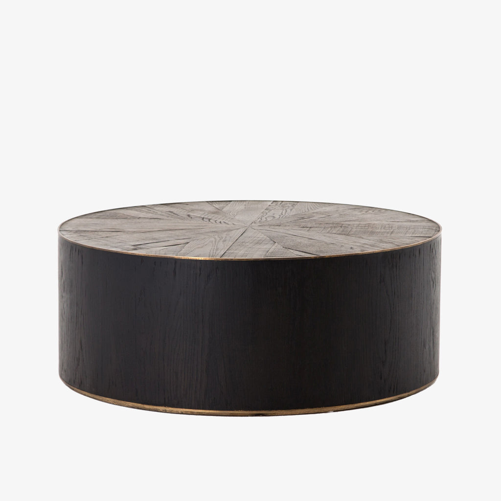 Dark wood 'Perry' coffee table with wood inlay and brass detailing by four hands furniture on a white background