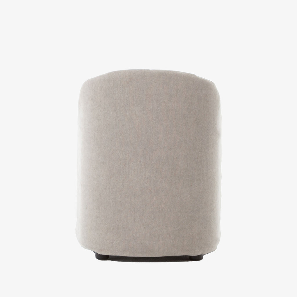 Rear view of Four hands furniture brand cove dining chair with linen slip cover on a white background