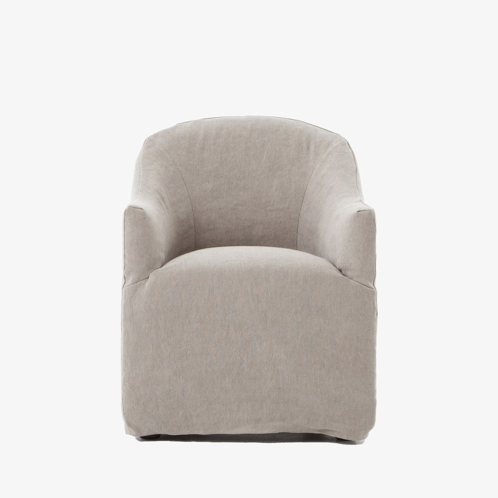 Four hands furniture brand cove dining chair with linen slip cover on a white background