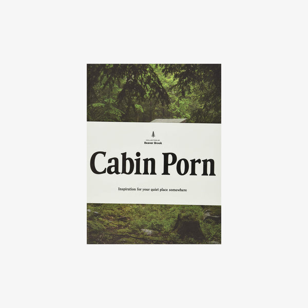 Front cover of book titled 'cabin porn' with woods and white and black letters 