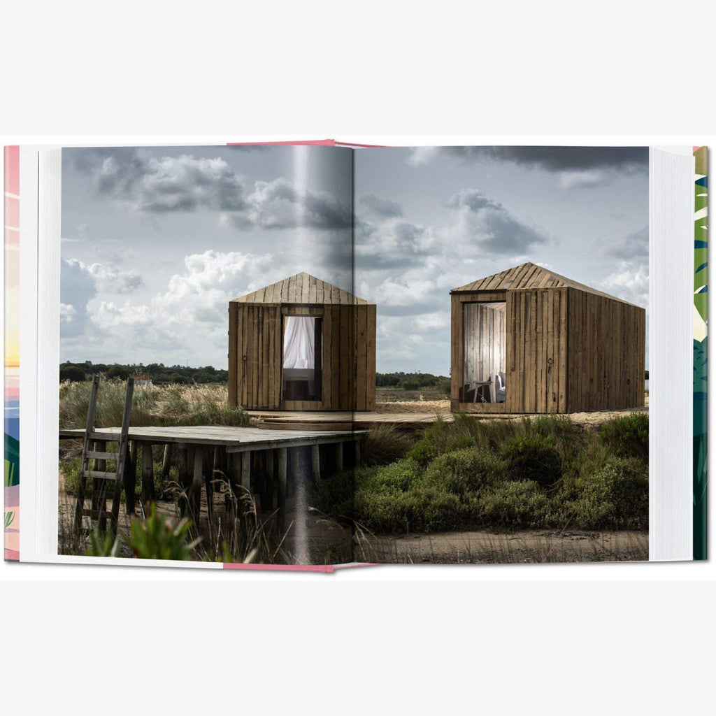 Inside pages of Taschen Cabins book on a white background