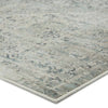Close up of Jaipur Living CAICOS rug with tones of blue, gray, ivory, and cream on a white background