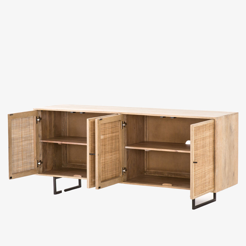 Four Hands furniture brand Carmel side board with four cane doors and metal legs with doors open on a white background
