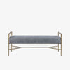 Bench with metal frame and grey upholstered seat on a white background
