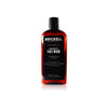 Brown Bottle of Brickell Clarifying Face Wash for Men with black label on a white background