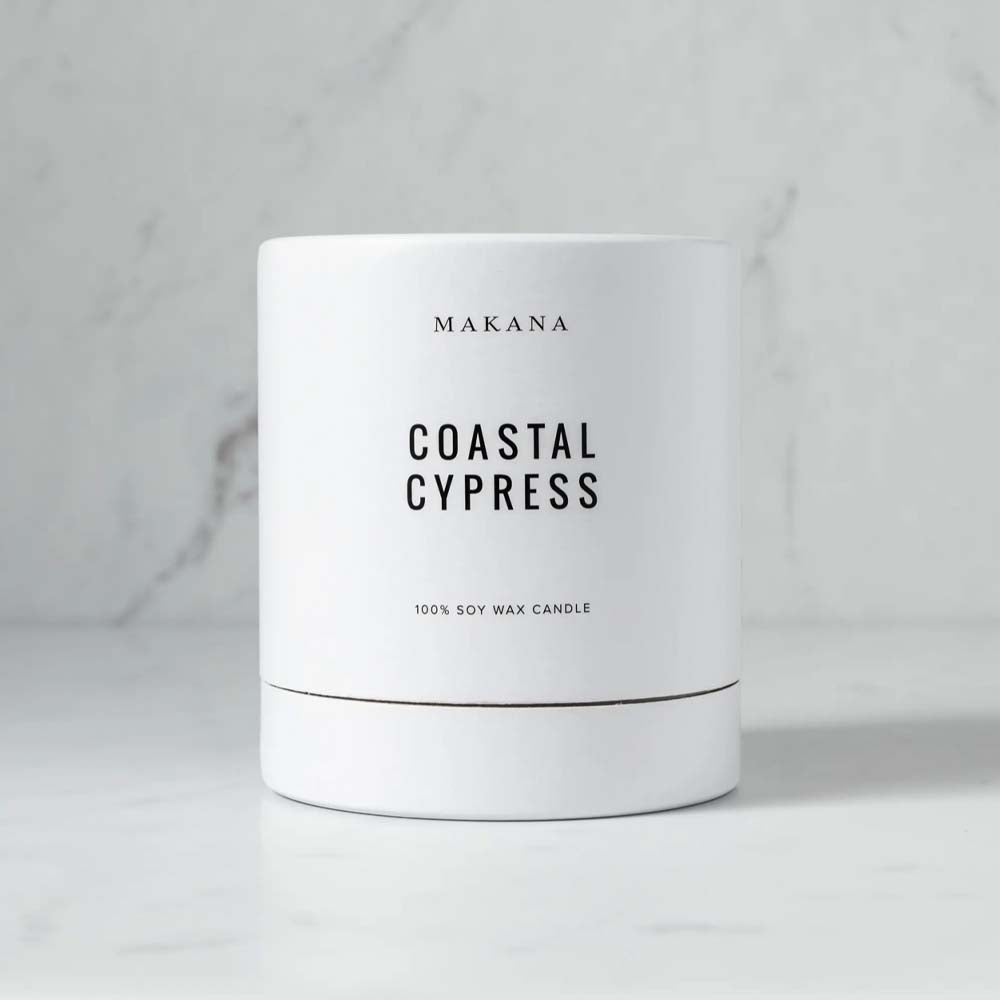 Makana brand coastal cypress white candle box on marble counter 