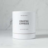 Makana brand coastal cypress white candle box on marble counter 