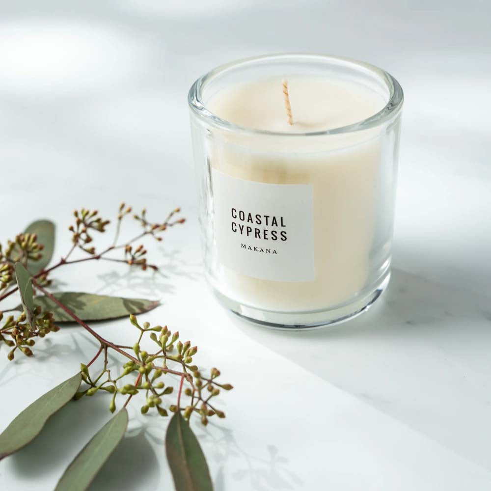 Makana brand coastal cypress candle with eucalyptus on marble counter 