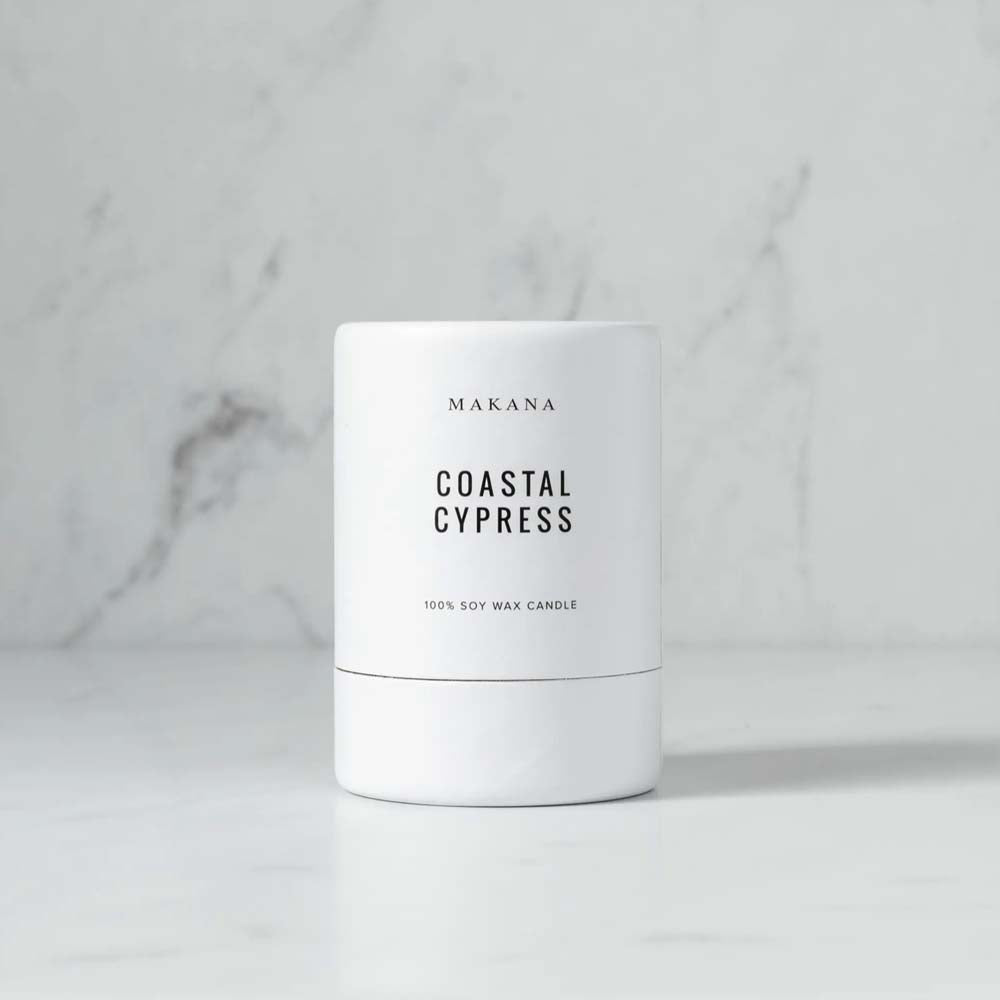 Makana brand coastal cypress white candle box on a marble counter