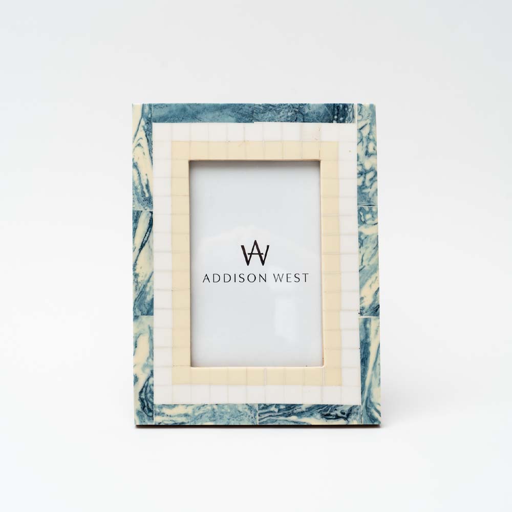 White and blue resin picture frame on a white background