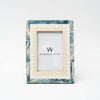 White and blue resin picture frame on a white background