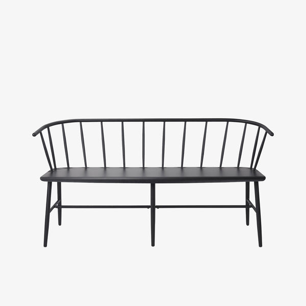 Black metal bench with Windsor chair styling and curves back rail on a white background