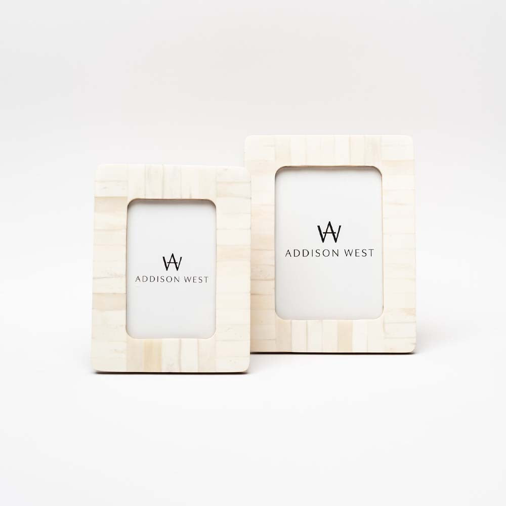 Set of two Zodax brand white bone inlay picture frames on a white background 