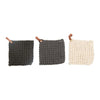 Three crocheted pot holders with leather loops on a white background surface