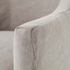 Close up of fabric arm on Four hands furniture brand cove dining chair with linen slip cover