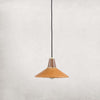Leather and walnut pendant light with brass accents and black cord on a white background