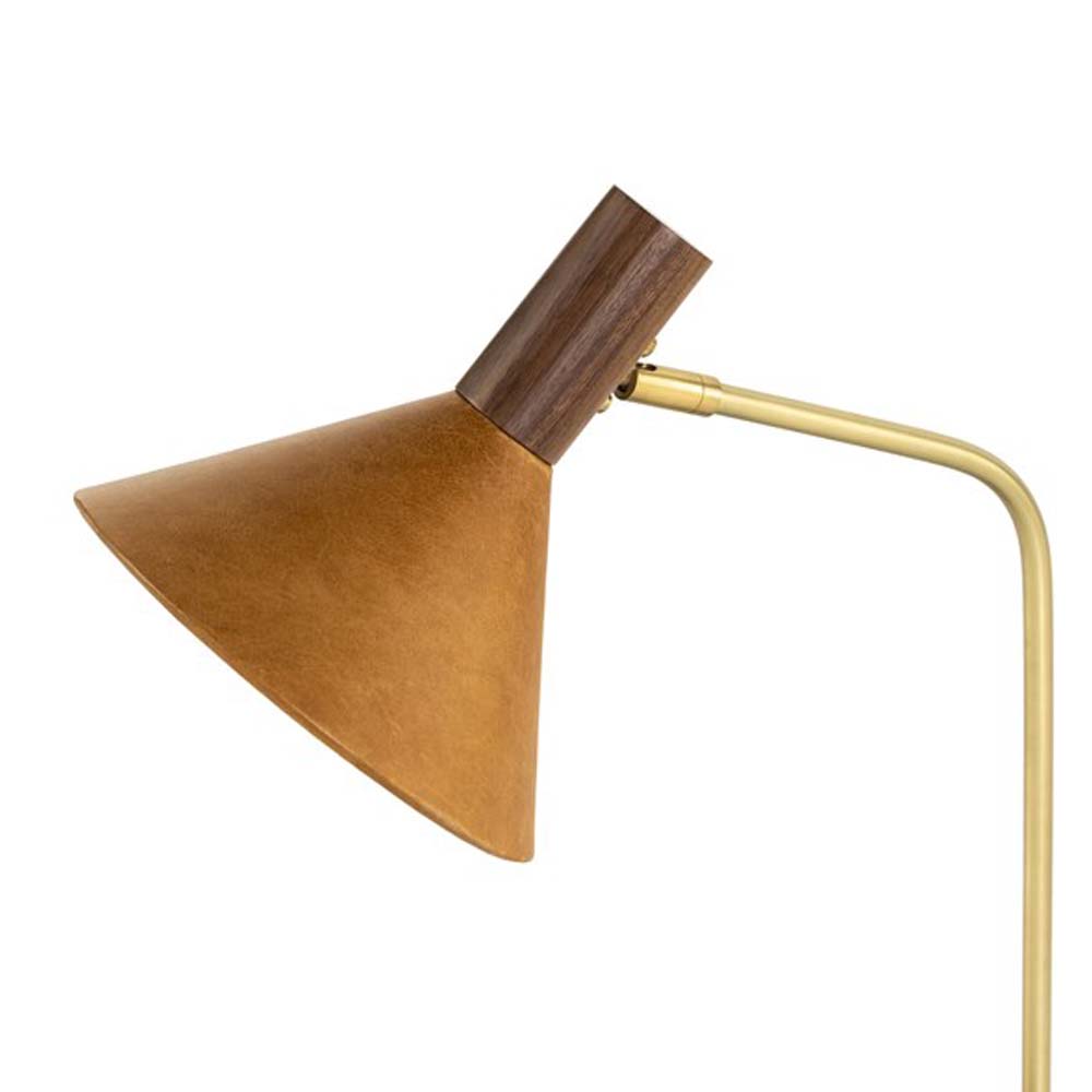Close up of Four hands brand Cullen task lamp in brass with leather shade and walnut accents on a white background