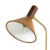 Close up of Four hands brand Cullen task lamp in brass with leather shade and walnut accents on a white background
