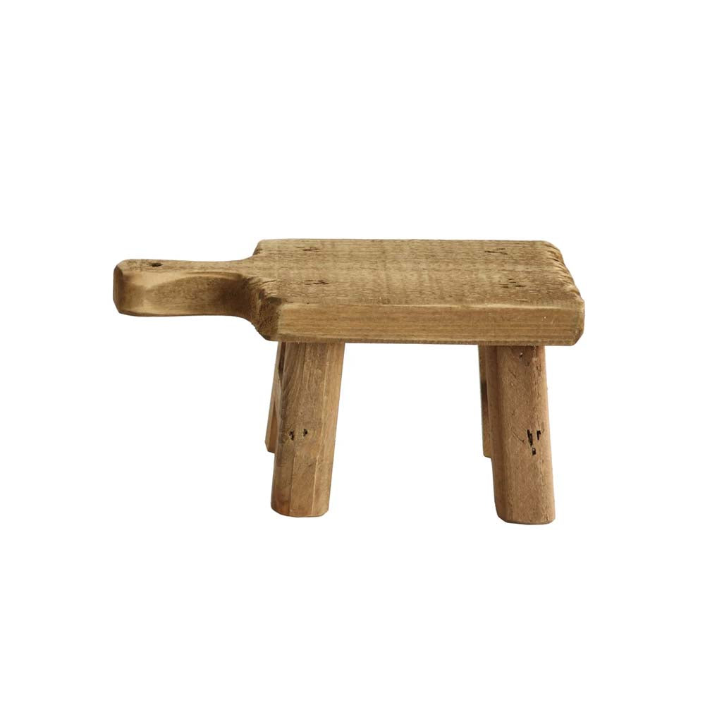 Small wood pedestal with four legs on a white background
