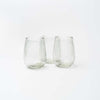 set of three stemless wine glasses on a white background.