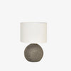 Black terra-cotta base table lamp with white canvas shade on a white background 