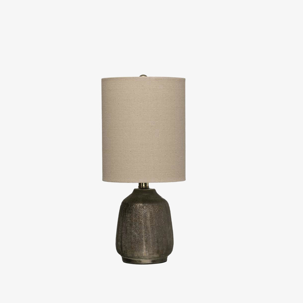 Small grey Terracotta Table Lamp with metallic glaze and linen shade on a white background