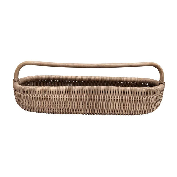 Long rattan basket with handle on a white background