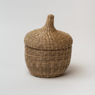 Large seagrass baskets with lid that look like an acorn on a white background