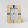 Picture frame with white bone inlay and navy blue accents on a white background