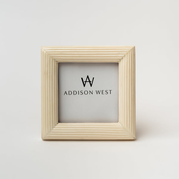 White frame for four by four inch photo on a white background