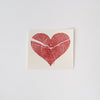 White Swedish cloth with red heart print on a white background